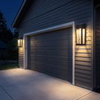 Solar wall lantern beside a garage door at night