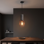 Concrete and Mesh Pendant Light in a dark modern dining room