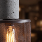 Concrete and Mesh Pendant Light close-up of the concrete cap and glowing mesh shade