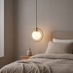 Brass Ring Globe Pendant Light in a bedroom