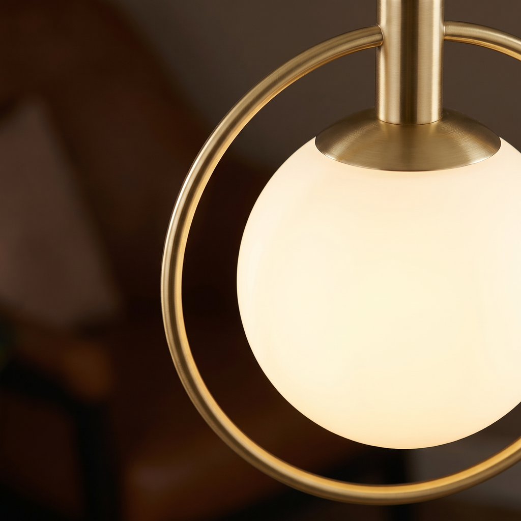 Brass Ring Globe Pendant Light close-up of the brass ring and opal glass globe