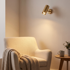 Adjustable Cylinder Wall Spotlight in a living room reading corner