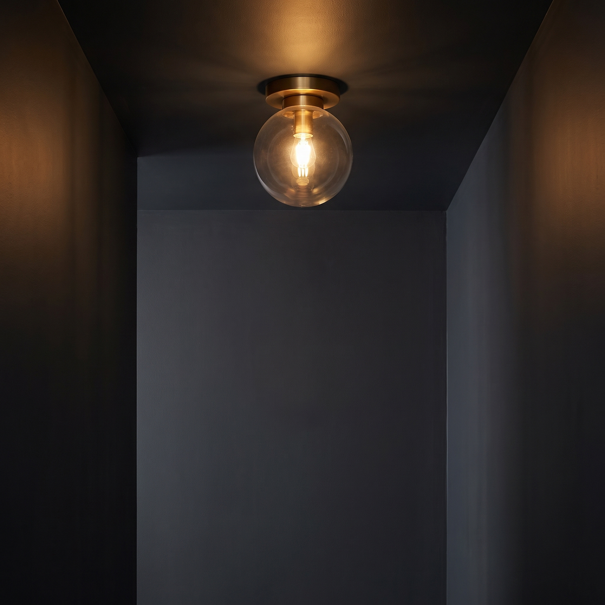 Glass Globe Flush Mount Light in a dark modern hallway