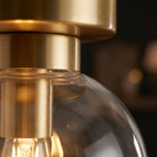 Glass Globe Flush Mount Light close-up of the glass globe and gold canopy
