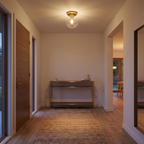 Glass Globe Flush Mount Light in a hallway, showing size