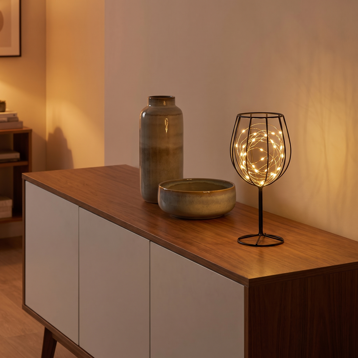 Wire Cage Battery Accent Lamp on a living room sideboard, showing size