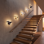 Origami Bird Wall Sconce on a staircase wall, showing size