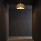 Stone Drum Flush Mount Ceiling Light in a dark modern hallway