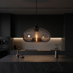 Oval Colored Glass Pendant Light in a dark modern kitchen