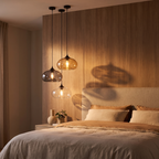 Oval Colored Glass Pendant Light in a bedroom