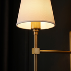 Brass Wall Sconce with Shade close-up of the white shade and brass rod