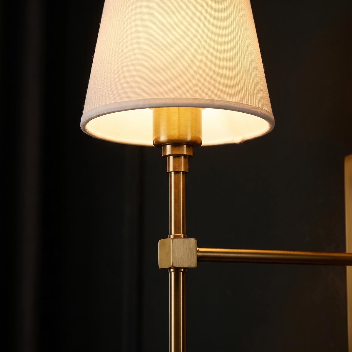 Brass Wall Sconce with Shade close-up of the white shade and brass rod