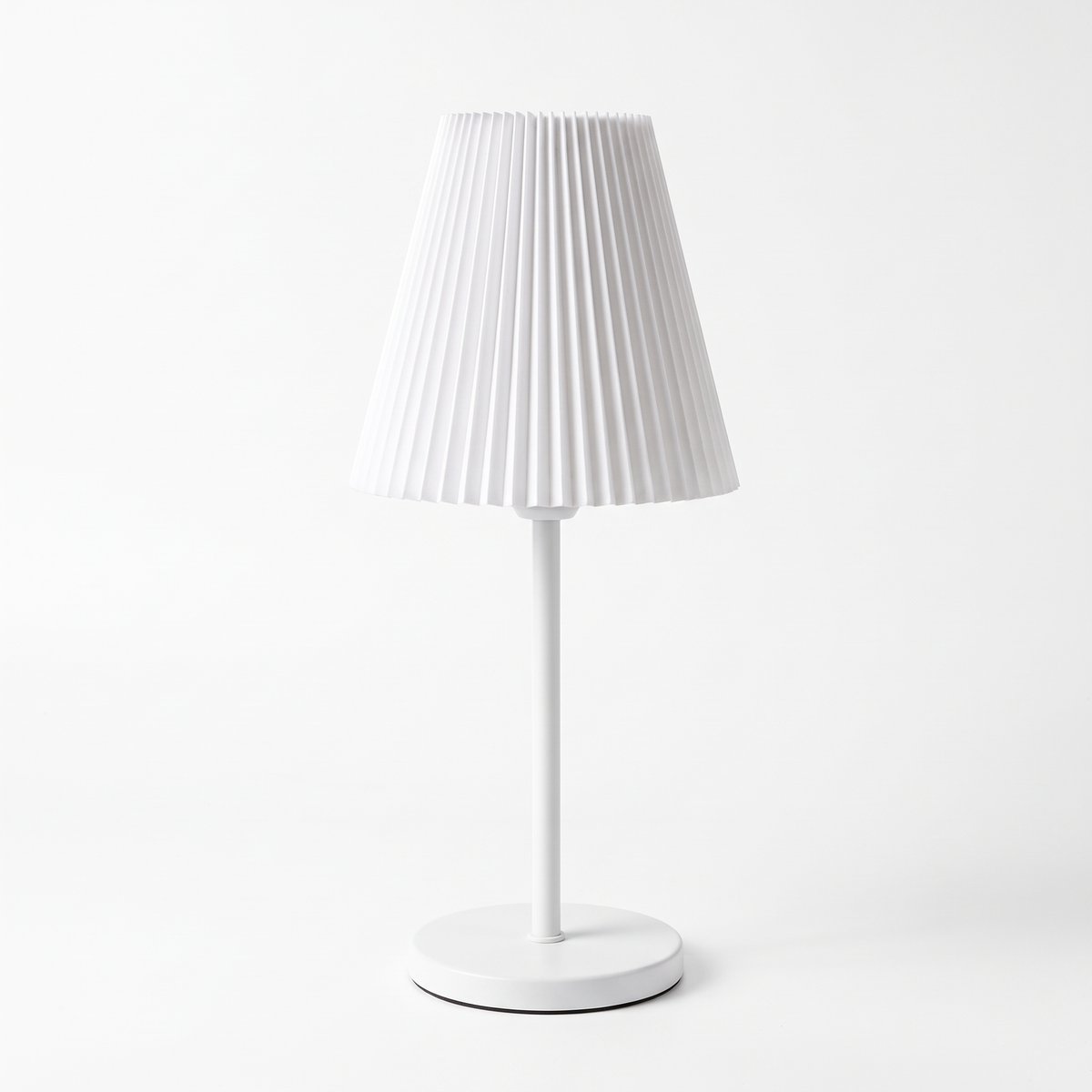 Pleated Shade Cordless Table Lamp in White on white background