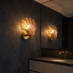 Seashell Glass Wall Sconce in a dark modern bathroom