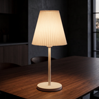 Pleated Shade Cordless Table Lamp in a dark modern dining room