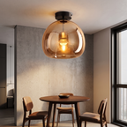 Smoked Glass Semi Flush Ceiling Light in cognac glass over a dining table