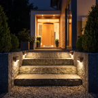 Solar step lights on stone garden steps at night