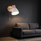 Nordic Wood Wall Sconce with Pull Chain beside a sofa