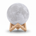3D Moon Lamp switched off on its wooden stand, on a white background