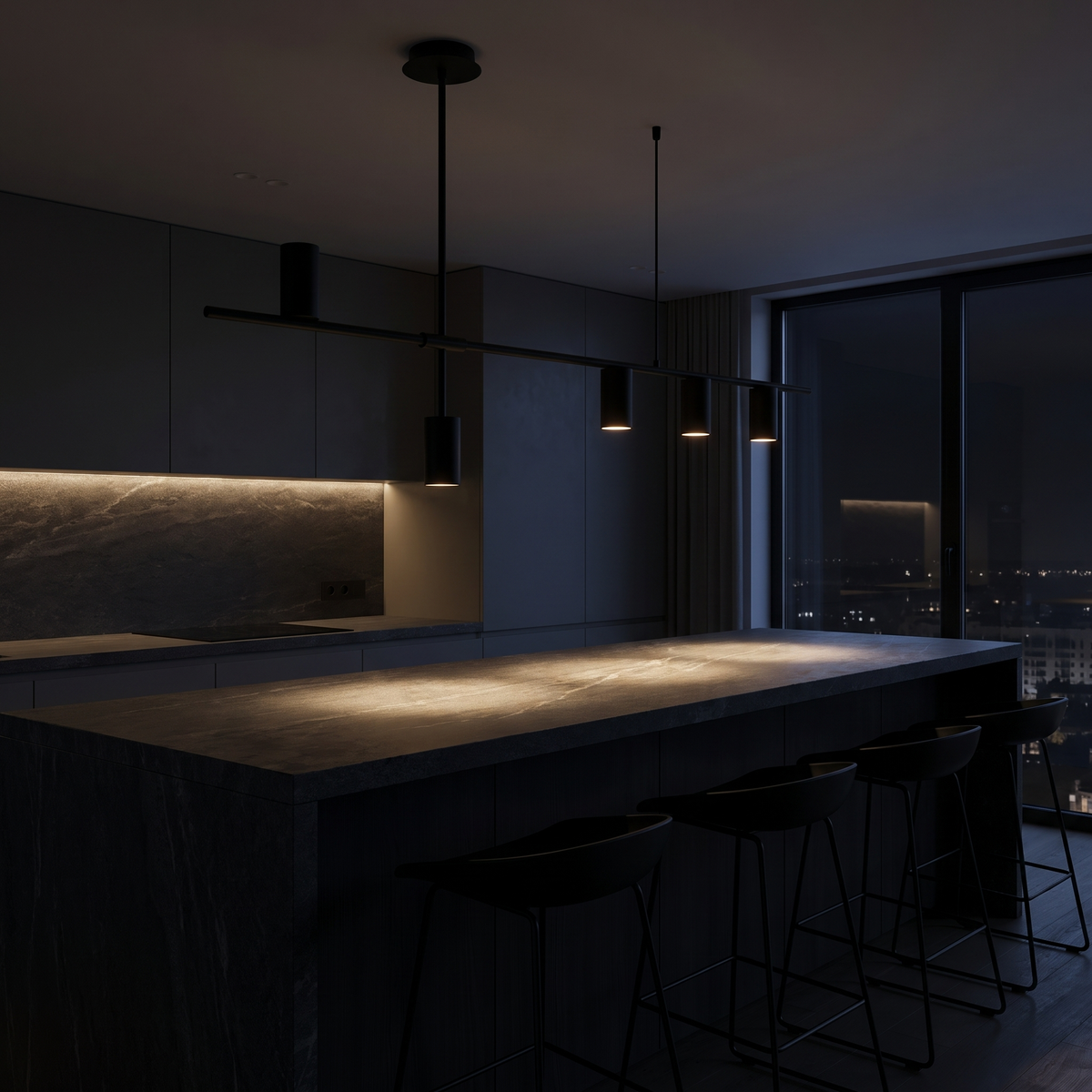 Modern Linear Spotlight Pendant Light over a dark stone kitchen island at night