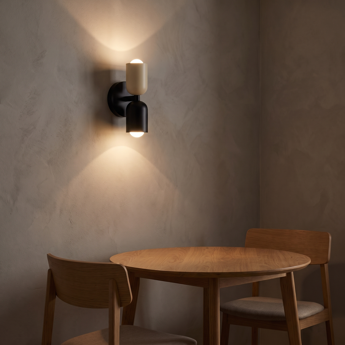 Modern Colorful Up Down Wall Sconce in black and cream above a breakfast table