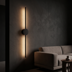 Modern Linear LED Wall Light mounted vertically beside a sofa in a dark living room