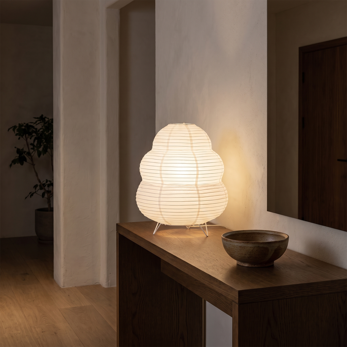 Japanese Tiered Rice Paper Lamp on an oak entryway console