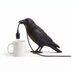 Halloween Raven Table Lamp size reference next to a mug