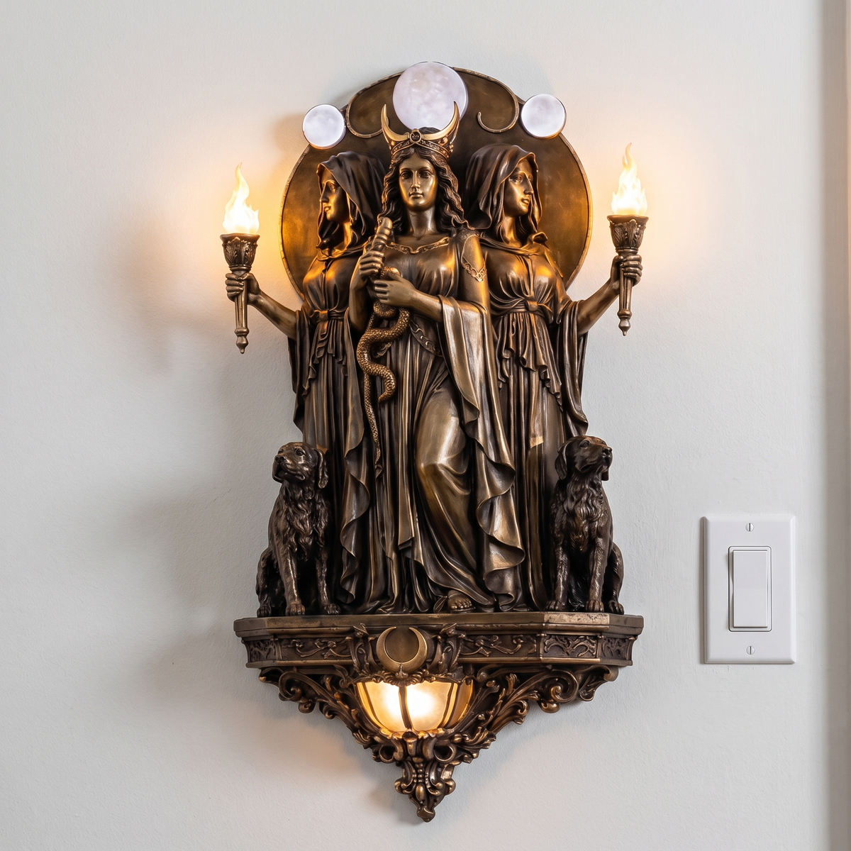 Hecate Triple Goddess Wall Sconce size reference beside a light switch