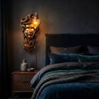 Medusa Wall Lamp, Gold beside a bed at night