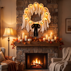 Halloween wreath - Light-Up Ghost Halloween Wreath above a fireplace mantel with candles and pumpkins