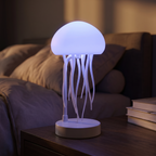 Jellyfish lamp - Jellyfish Lamp with Moving Tentacles glowing soft blue on a nightstand