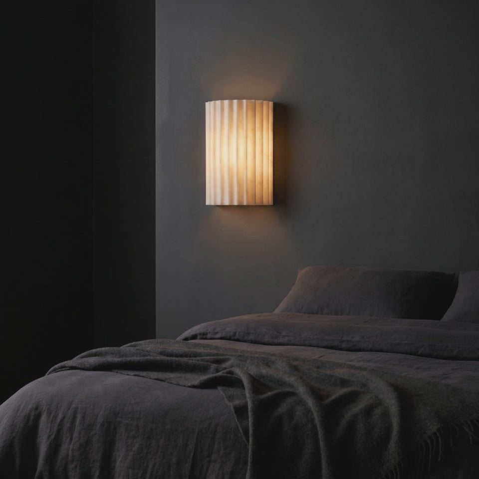 Fluted Resin Wall Sconce washing a bedroom wall with warm light (short video)