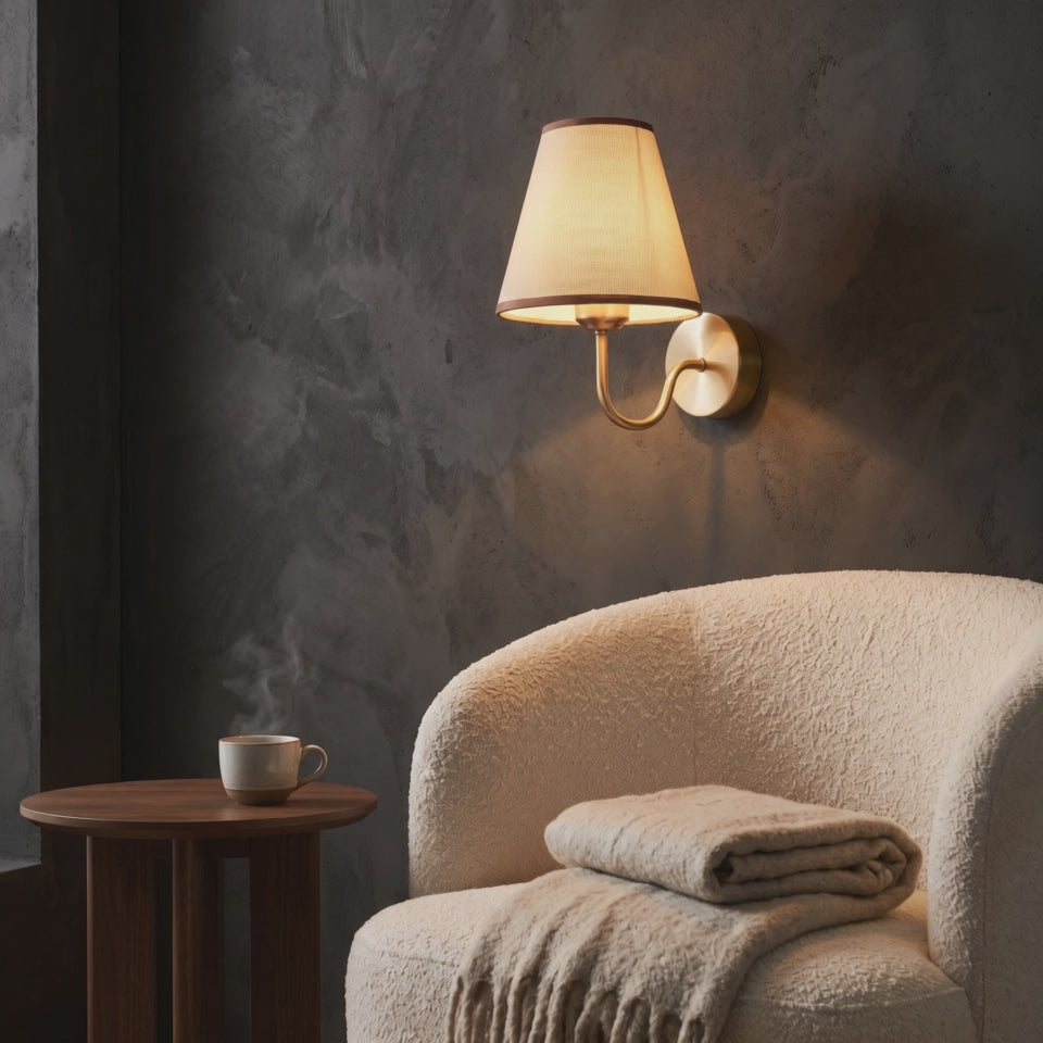 Modern Nordic Fabric Shade Rechargeable Wall Sconce glowing beside a reading chair (short video)
