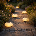 Solar garden light - Solar Cobblestone Garden Light along a garden path at dusk