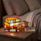 Book lamp - Stained Glass Style Stacked Books Lamp on a bedside table next to a mug for scale